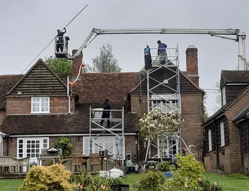 The Moss Cleaners using cherry picker and scaffolding to clean roof safely and professionally in 61A Station Rd, Yiewsley, West Drayton UB7 7LR, UK, 61A Station Rd, Yiewsley, West Drayton UB7 7LR, UK